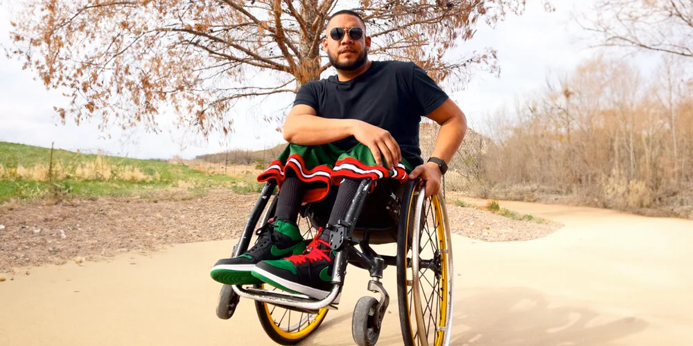 Image of a man adventuring in nature while moving around with his Spinergy XSLX Wheels - High-Performance Wheelchair Wheels for Speed and Efficiency