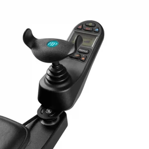 A close-up photo of a black, U-shaped joystick handle made from a soft, rubbery material on wheelchair. The handle has vertical wings on either side and a textured grip surface.