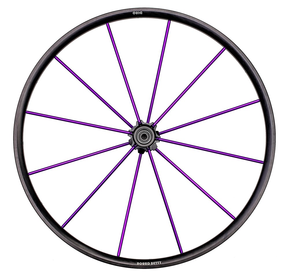 Frontal image of purple Dino V2 Wheelchair Wheel - Lightweight, high-performance wheelchair wheel with a double-walled aluminum rim and tubular spokes for increased responsiveness and easier pushing.