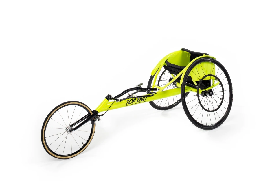 Left side view of the yellow Top End OSR Racing Wheelchair Open V Cage.