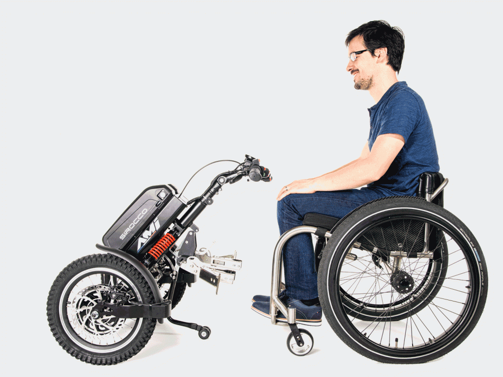 Picture by Picture display of the Praschberger Vario Drive power assist being attached to wheelchair. Effortless Assistance for Everyday Mobility Needs