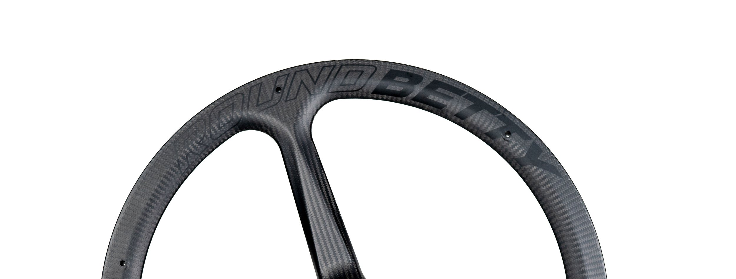 Frontal image of Round Betty Carbon Spoke Wheel - Lightweight and high-performance wheelchair wheel featuring a carbon fiber rim and spokes for increased responsiveness and easier pushing.