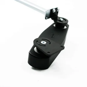 Side view of the Retractable Joystick Mount. A sleek, metal joystick mount attached to a wheelchair armrest. The joystick can be easily swung outwards or retracted sideways for improved accessibility.