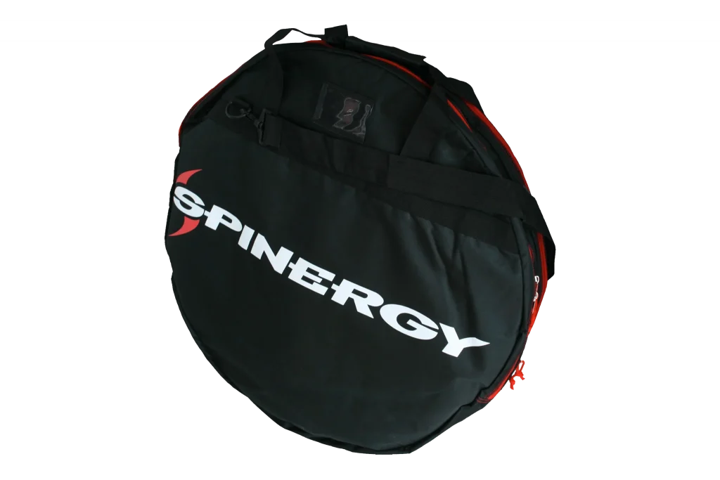 Front image of the Spinergy Wheel bag. A black, padded Spinergy wheel bag with a removable shoulder strap and carrying handles.