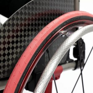 Close up image of the TC MAX Stainless Steel Handrims - Durable, high-performance handrims for wheelchairs, featuring a stainless steel construction for strength and a textured grip surface for improved control.