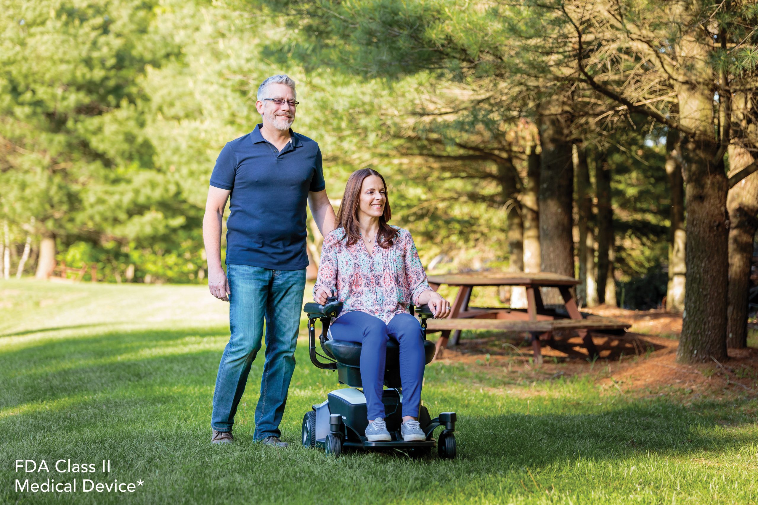 Image of a woman and man using the Go Chair Wheelchair - Lightweight, portable manual wheelchair designed for easy folding and transportation, ideal for travel and storage.